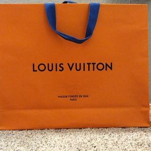 A Louis Vuitton Packaging box and bag